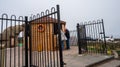 Couple paying for a round of crazy golf in the seaside town of Cromer