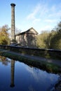 The Leawood Pump House (1849) reflected in the still water of Cromford Canal. Cromford, , Derbyshire, UK. Royalty Free Stock Photo