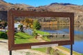 Cromwell, New Zealand. The Cromwell Heritage Precinct and Lake Dunstan, seen through a photo frame