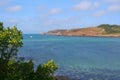 Cromwell\'s Castle on Tresco, seen in the distance, shot from Bryher. Tresco is in the Isles of Scilly, Cornwall, England. Royalty Free Stock Photo