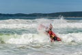 Surf rescue life savers boat jumping on the waves at Wanda Beach