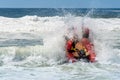 Surf rescue life savers boat jumping on the waves at Wanda Beach, NSW, Australia Royalty Free Stock Photo