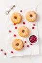 Cronuts - delicious fusion of croissant and donut with raspberry jam Royalty Free Stock Photo