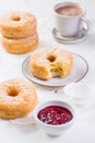 Cronuts - delicious fusion of croissant and donut with raspberry jam Royalty Free Stock Photo