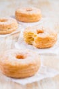 Cronuts - delicious fusion of croissant and donut with raspberry jam Royalty Free Stock Photo