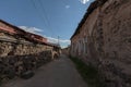 crooked road in the midst of residential stone houses