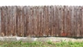 Crooked ugly wooden rural fence isolated on top. Royalty Free Stock Photo