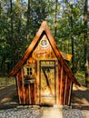 Crooked wood house in the forest for sale