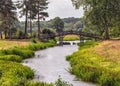 Croome River and the Chinese Bridge in Croome Park, Worcestershire, England. Royalty Free Stock Photo