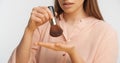 Crop banner size shot of some female hands holding a face powder brush. Royalty Free Stock Photo