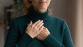 Close up of woman hold hands in prayer feeling grateful Royalty Free Stock Photo