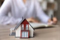 Crop close up house model miniature on realtor table Royalty Free Stock Photo