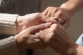 Close up of mature mom and daughter holding hands Royalty Free Stock Photo