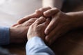 Close up of old dad and son hold hands Royalty Free Stock Photo