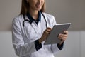 Close up of female doctor use modern tablet Royalty Free Stock Photo