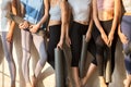 Legs of toned girls waiting for yoga session Royalty Free Stock Photo