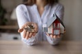 Crop close up woman realtor holding keys and house model Royalty Free Stock Photo