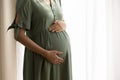 Close up of pregnant woman touch baby bump Royalty Free Stock Photo