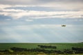 A crop duster flying on a sugar cane field Royalty Free Stock Photo