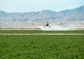 Crop duster over alfalfa in the Mohave Valley Royalty Free Stock Photo