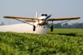 Crop Duster Plane Applying Pesticide To Cotton Fields In Texas