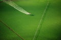 A crop duster aircraft working over a green farm field. Royalty Free Stock Photo