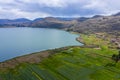 Crop fields in the Peruvian Andes Paca lake in Junin Royalty Free Stock Photo