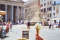 Crop hand holding gelato on Roman street