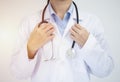 Crop image of professional confident young female asian doctor in white coat, stethoscope over neck Royalty Free Stock Photo