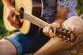 Crop of incognito male hand playing on guitar. Royalty Free Stock Photo