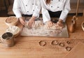 Crop kids kneading dough on table Royalty Free Stock Photo