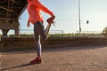 Crop of sporty woman stretch before outdoor training Royalty Free Stock Photo