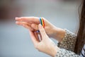 Crop person with LGBT bracelet