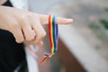 Crop person with LGBT bracelet