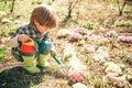 Crop planting at fields. Happy childhood concept. Kid portrait on farmland. Happy little farmer having fun on spring