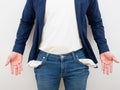 Crop shot of man body without money in jean pocket and empty hand on white background poor people concept Royalty Free Stock Photo