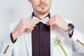 Crop trendy man in groom suit