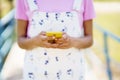 Faceless woman browsing smartphone on street