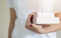 Crop unrecognizable female student in casual clothes holding books and notebook in hands Royalty Free Stock Photo