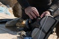 Crop view of scuba diver adult man on a seashore with spearfishing gear and freshly caught octopus Royalty Free Stock Photo