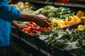 Crop view of someone buying a mix of veggies at the farmers\' market Royalty Free Stock Photo