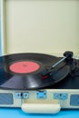 crop Vintage vinyl player black plate and plays. Vertical photo Royalty Free Stock Photo