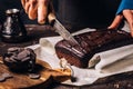 Woman cutting brown chocolate bread Royalty Free Stock Photo