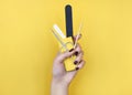 Crop woman with manicure supplies