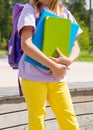 Croped image of a Girl Ready For School With Backpack and Books