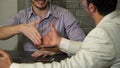 Cropepd shot of two businessmen talking during the meeting at the office