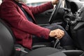 Cropped of aged man in suit driving car Royalty Free Stock Photo