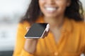 Cropped of black woman holding smartphone with blank screen Royalty Free Stock Photo