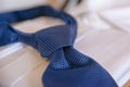 Cropped blue necktie on a white blurred background Royalty Free Stock Photo