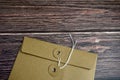 Brown envelope on horizontal wooden table Royalty Free Stock Photo